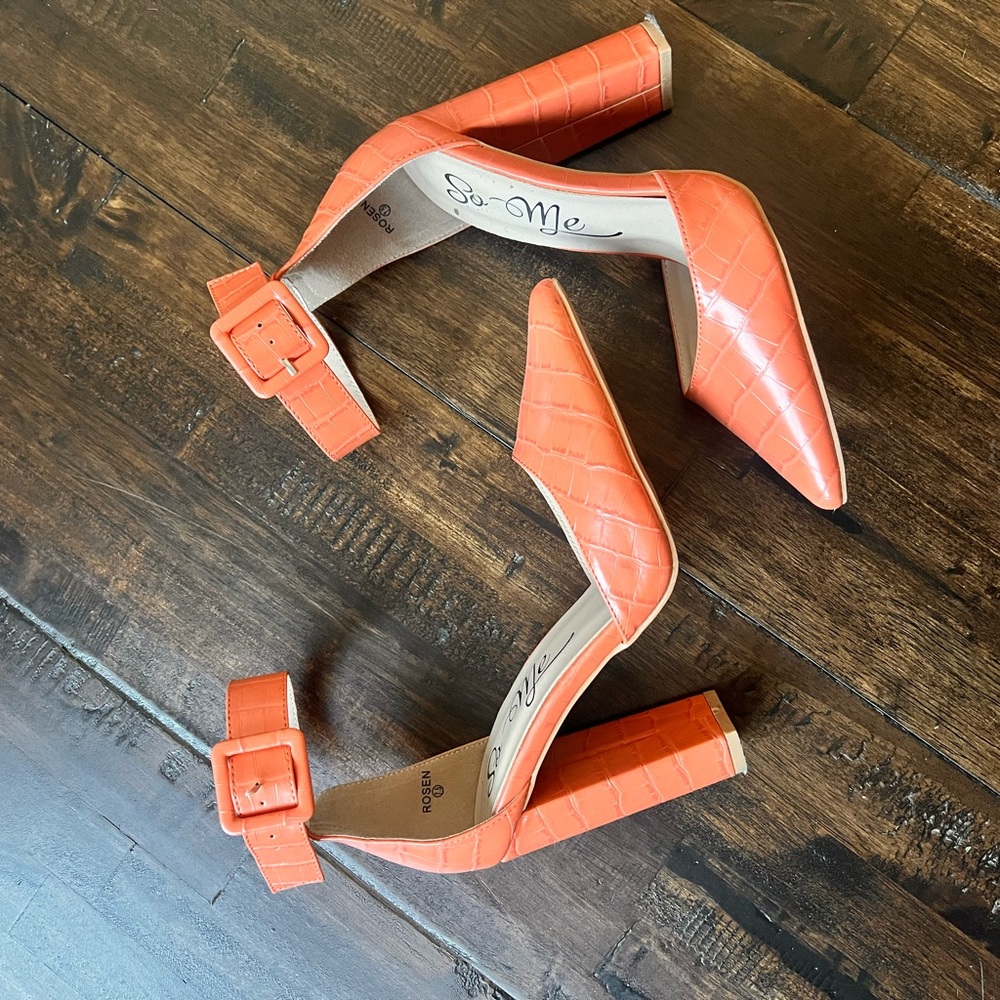 Orange heels with snake skin texture